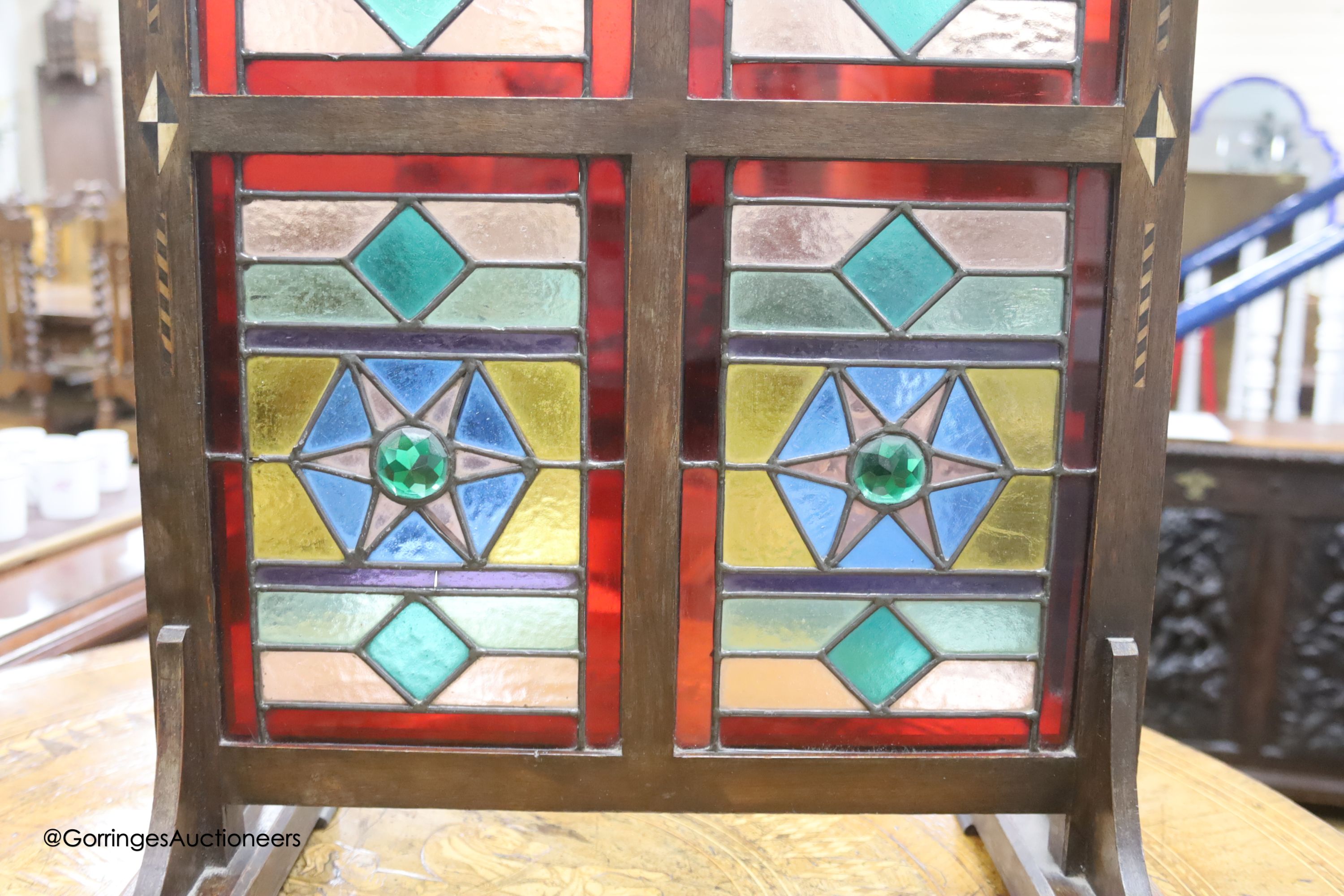 An Edwardian Liberty & Co. stained glass and beech leaded glass room screen, width 43cm, height 67cm